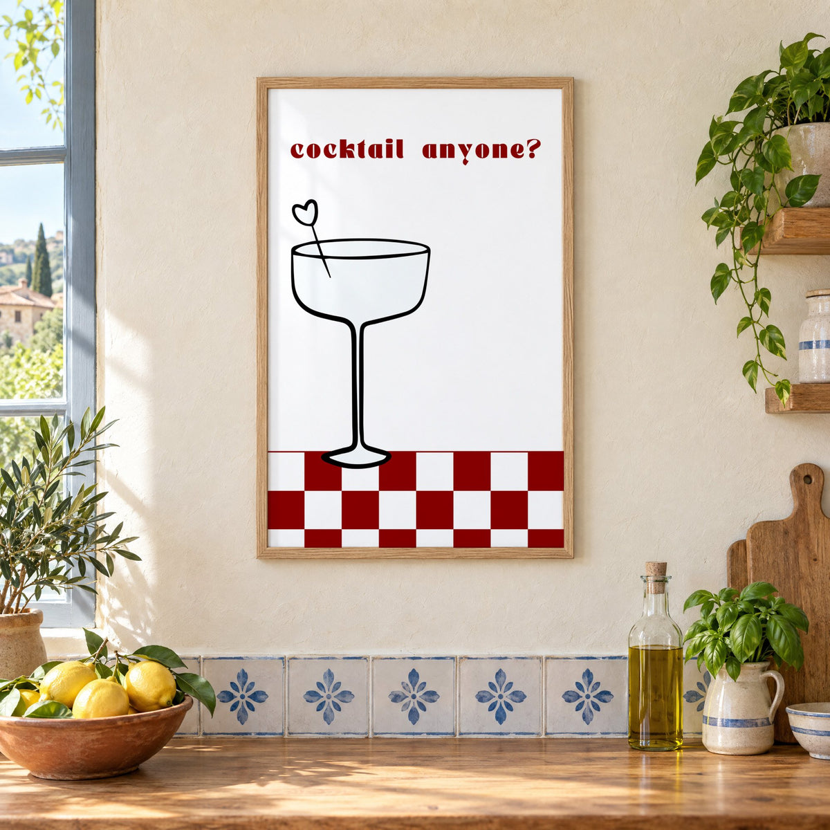 cocktail anyone? coupe check floor print in an oak frame on a cream plaster wall above a worktop with a bowl of lemons and blue-and-white tiles