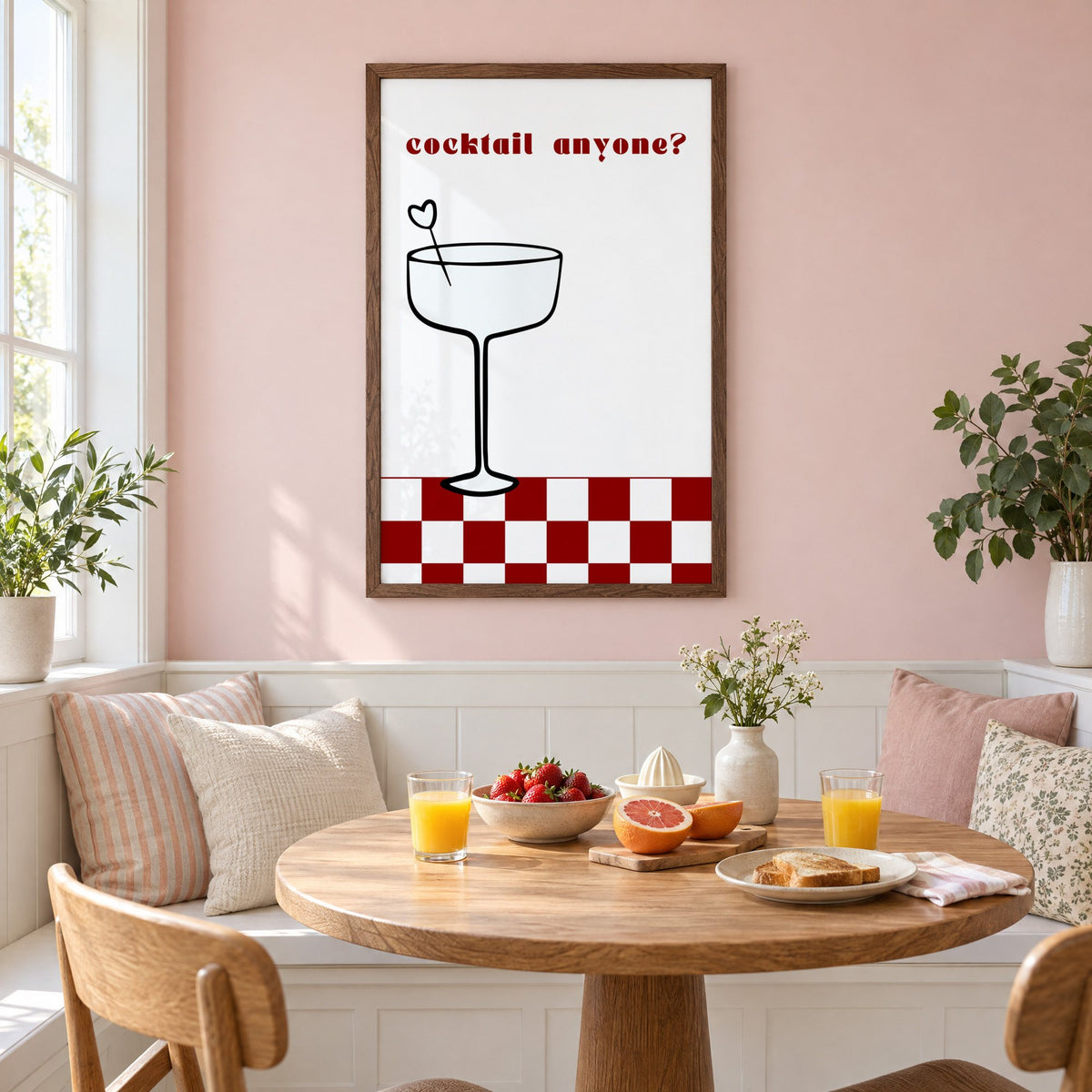 cocktail anyone? coupe check floor print in a walnut frame on a pastel pink wall above a breakfast nook with strawberries and orange juice
