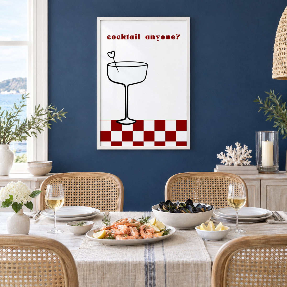 cocktail anyone? coupe check floor print in a white frame on a navy wall above a dining table set with shrimp and mussels