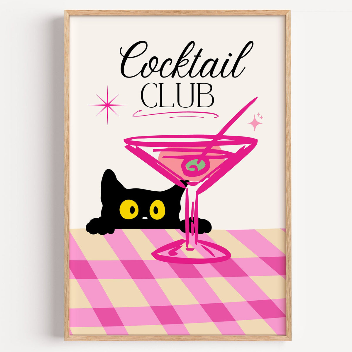Cocktail Club black cat martini print in a light oak frame on a plain white wall