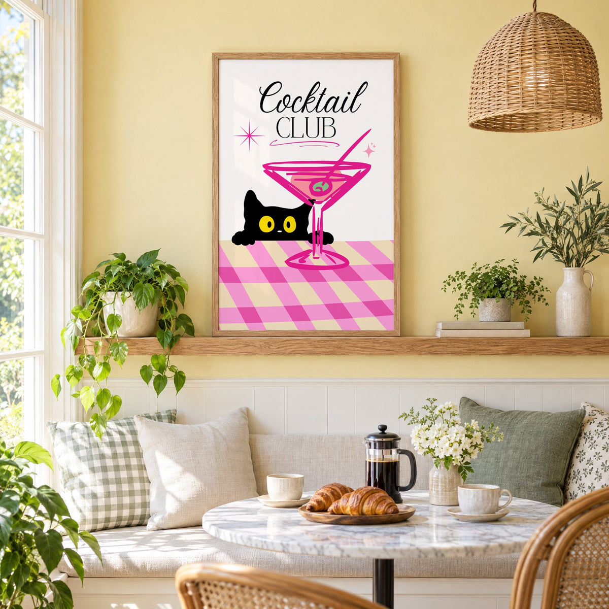 Cocktail Club black cat martini print in an oak frame on a picture ledge above a sunny breakfast nook