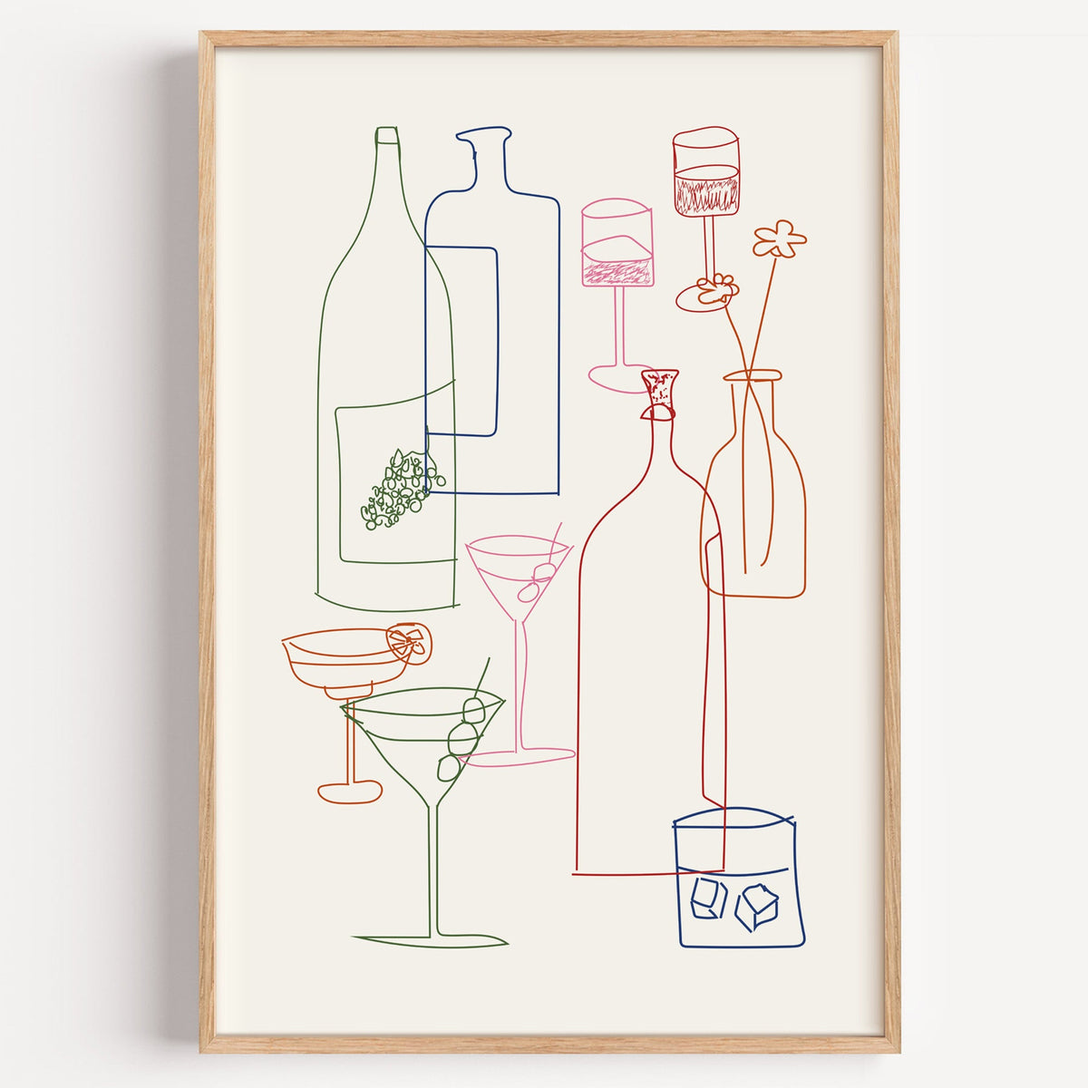 Cocktail glassware line art print in a light oak frame on a plain white wall