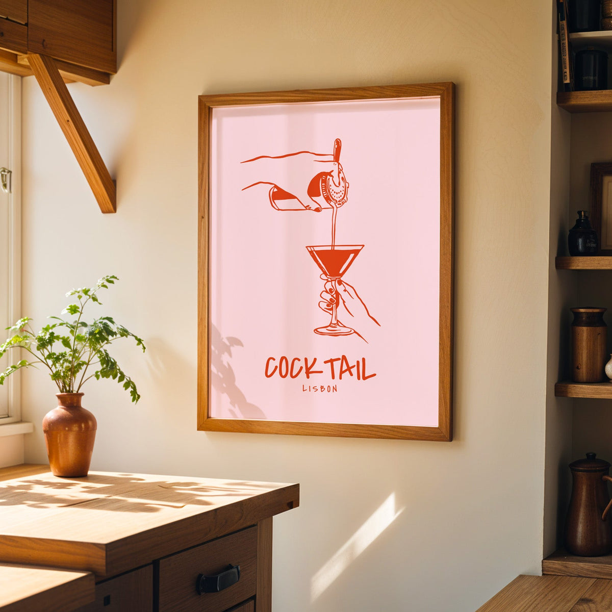 Cocktail Lisbon print in a walnut frame on a cream kitchen wall above the island