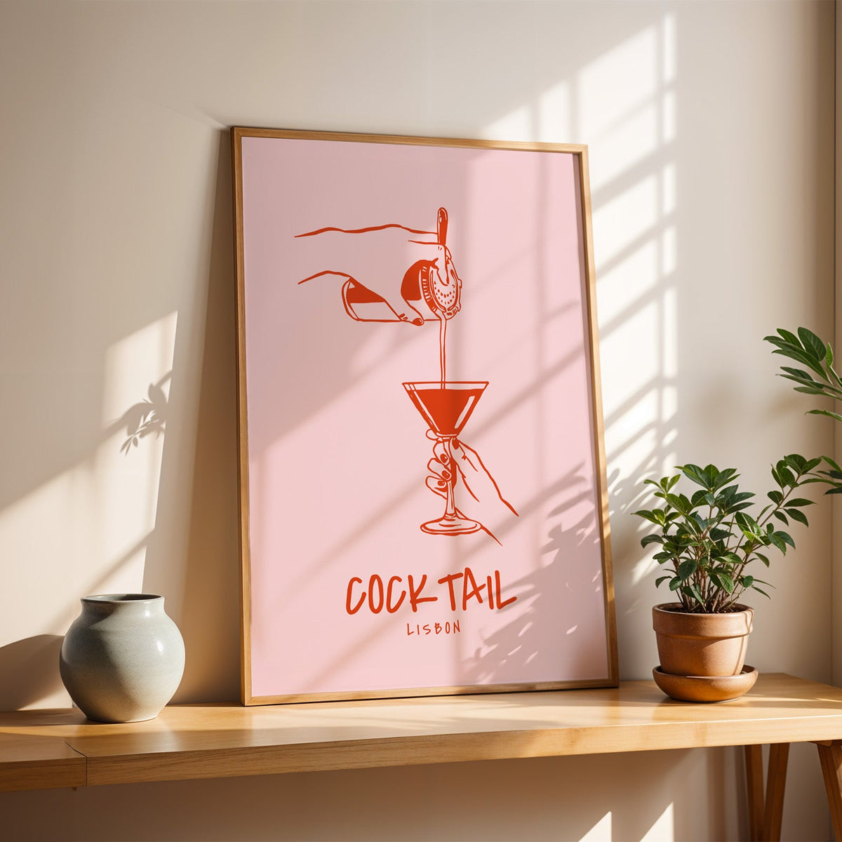 Cocktail Lisbon print in a slim oak frame on a console with a grey-blue vase