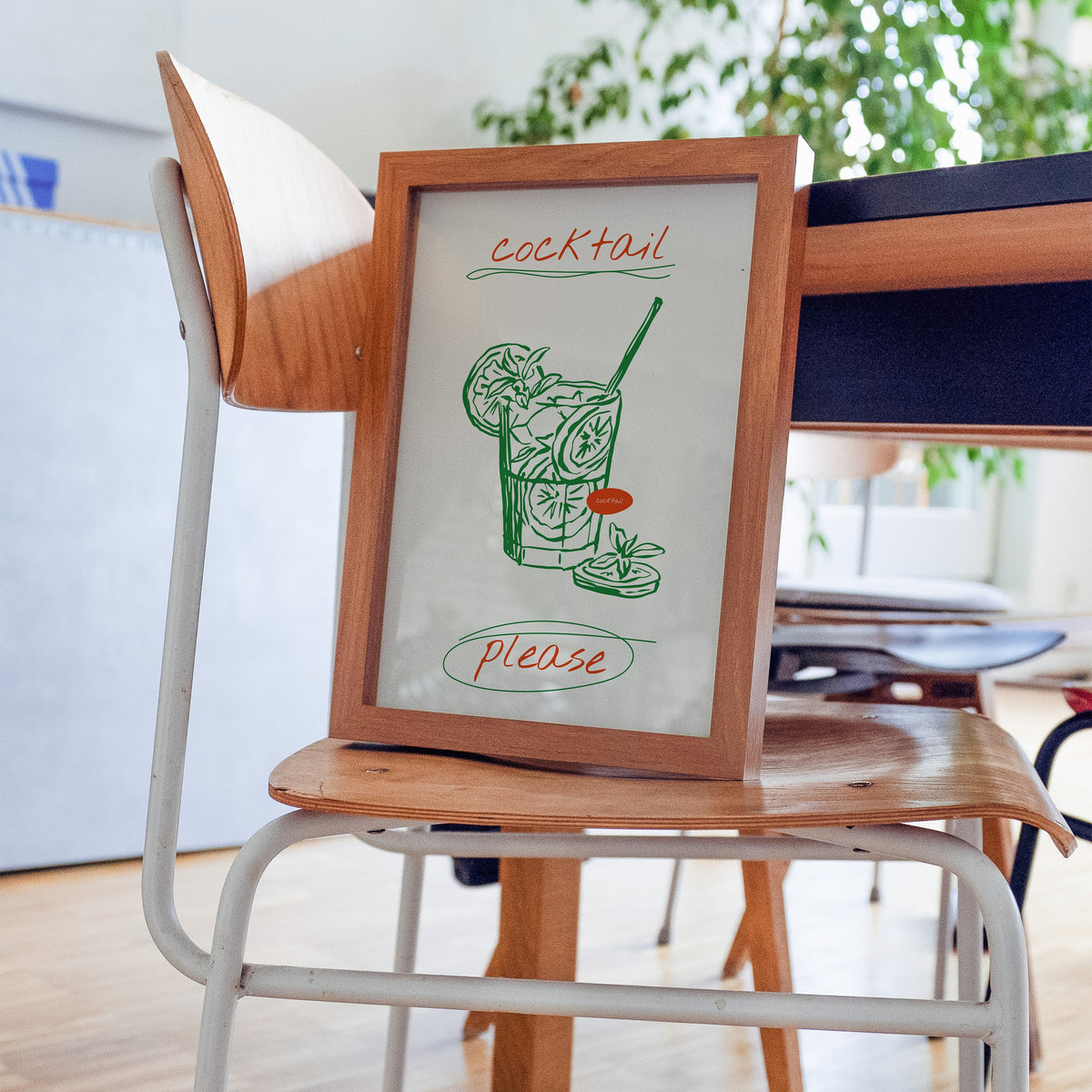 Cocktail Please mojito print in a walnut frame on a bentwood chair