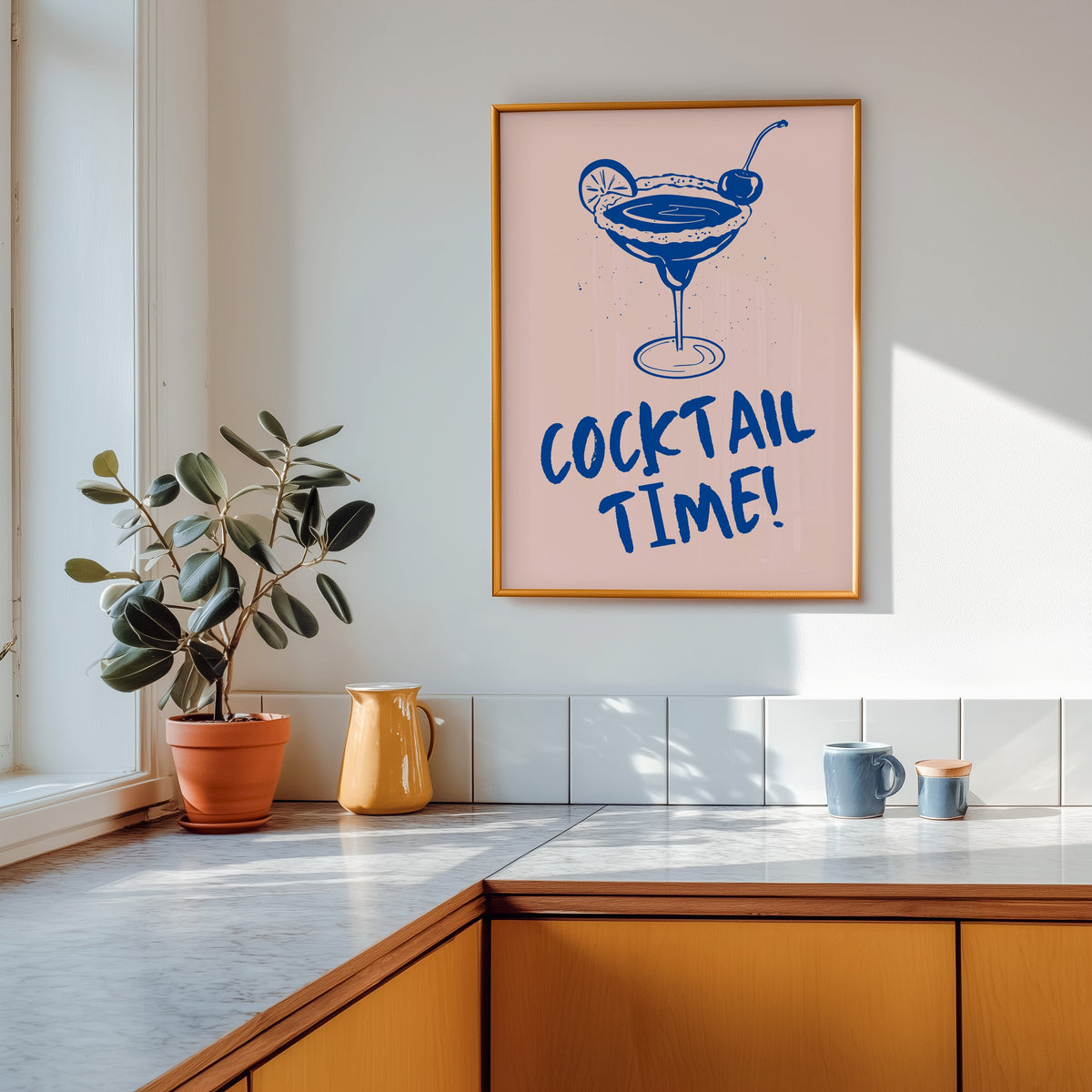 Cocktail Time margarita print shown in a gold frame above a marble counter with a yellow ceramic jug