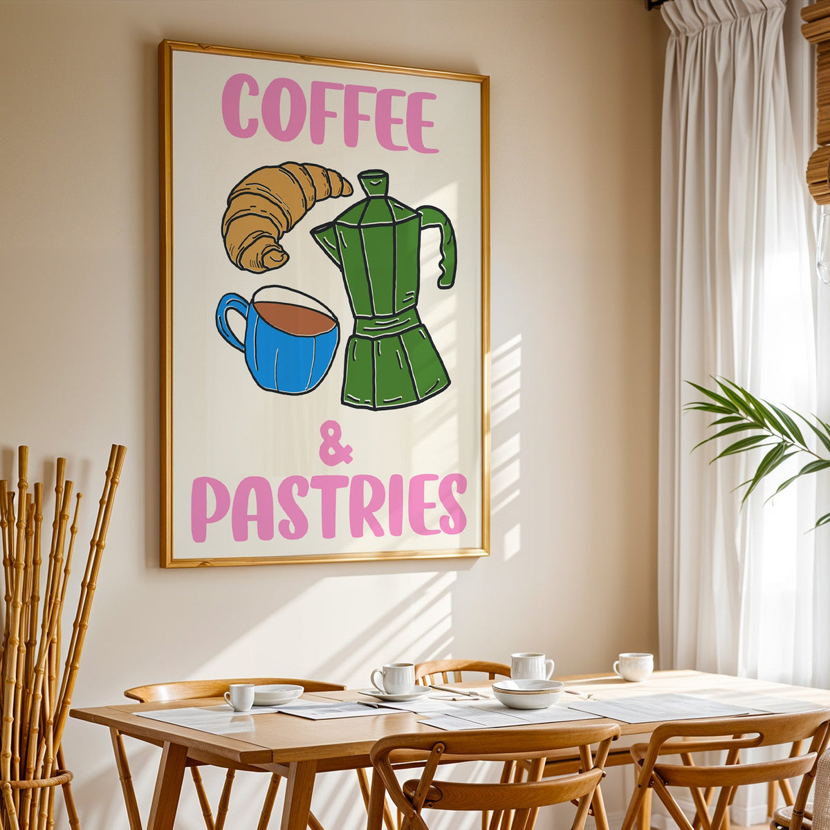 Coffee and pastries print in a gold frame above a sunlit breakfast table
