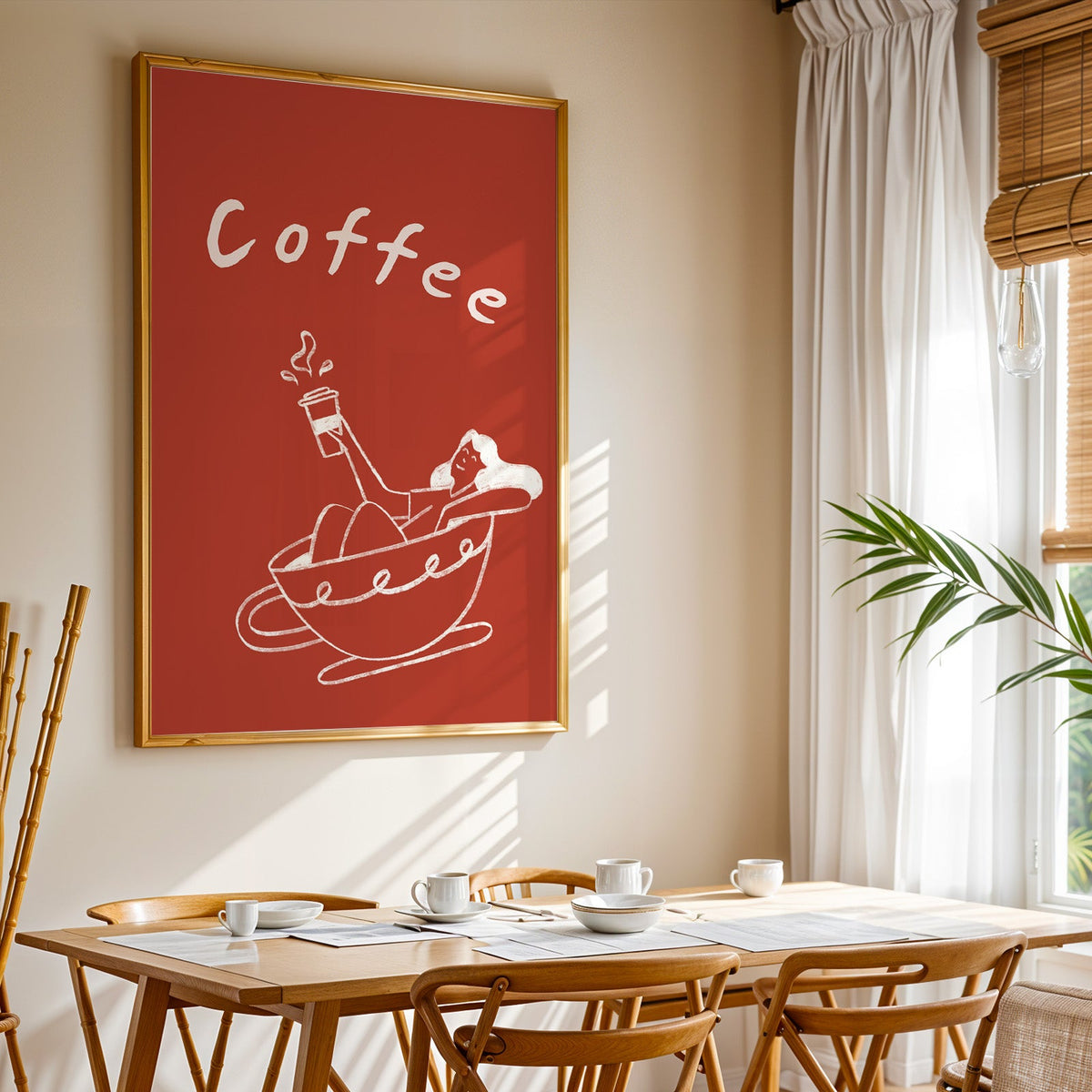 Coffee Bath print shown in a gold frame above a breakfast table by a curtained window