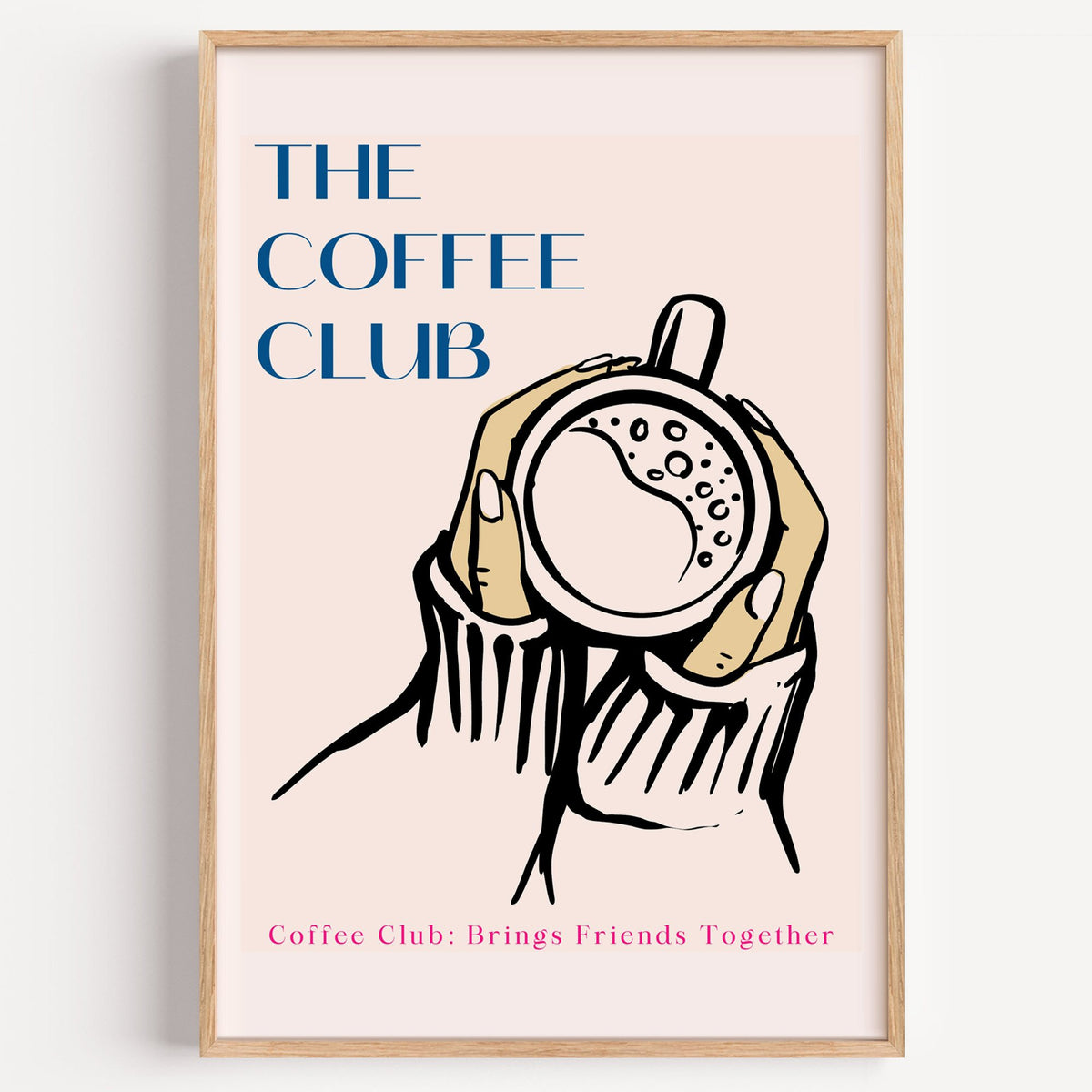 The Coffee Club hands and cup print in a light oak frame on a plain white wall