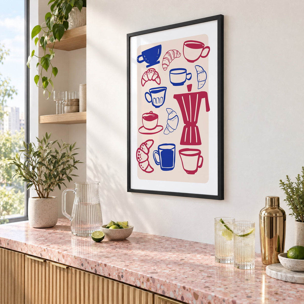 Moka pot, cups and croissants pattern in a black frame above a pink terrazzo cocktail counter with limes, seen at an angle