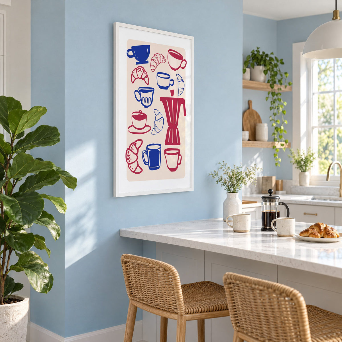Moka pot, cups and croissants pattern in a white frame on a pale blue wall above a breakfast bar with rattan stools