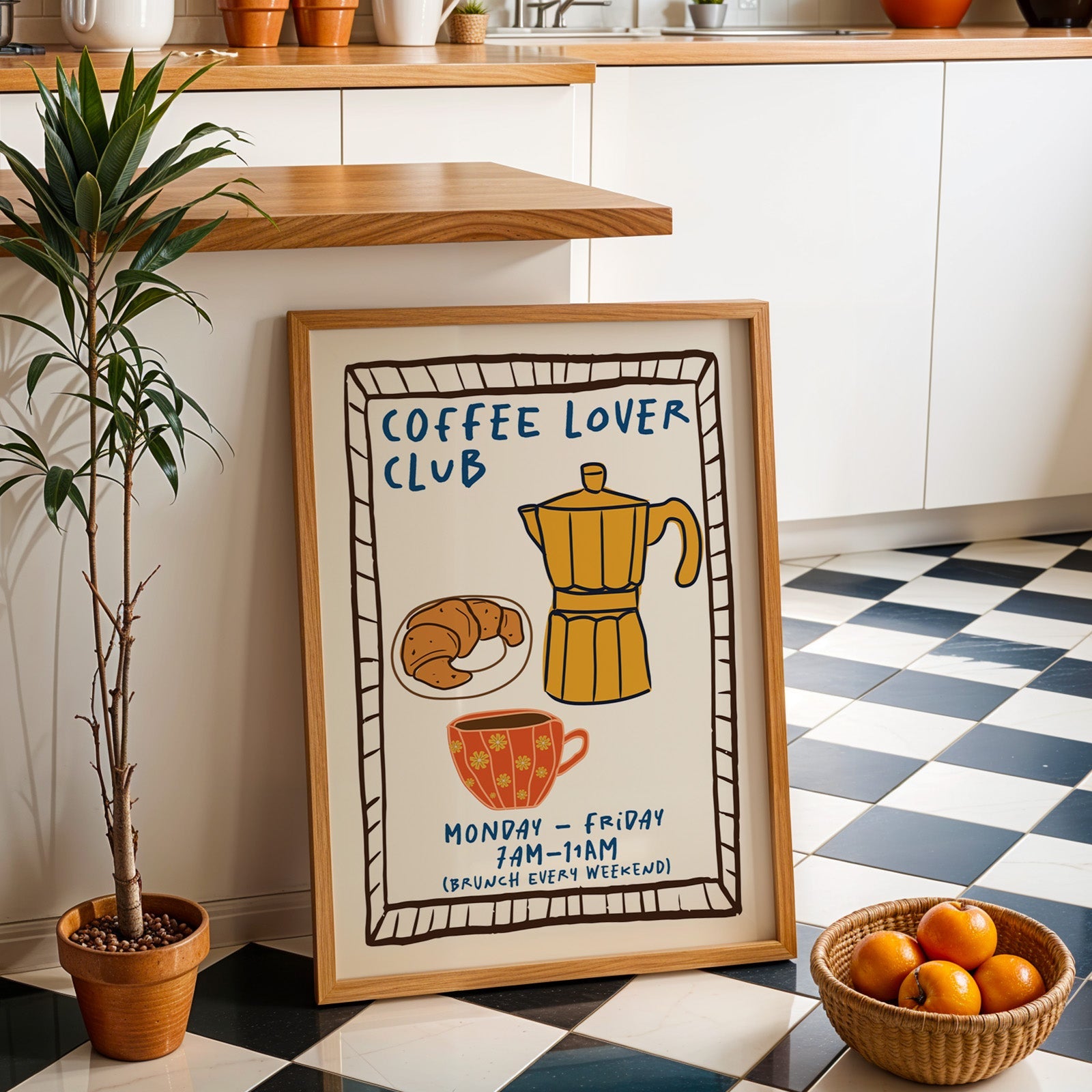 Coffee lover club moka pot print in an oak frame by a kitchen island and checkered floor