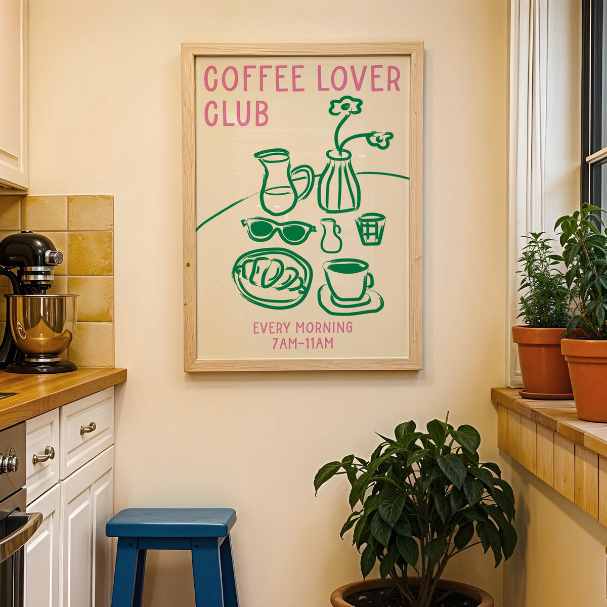 Coffee lover club morning print in a wood frame on a yellow tiled kitchen wall