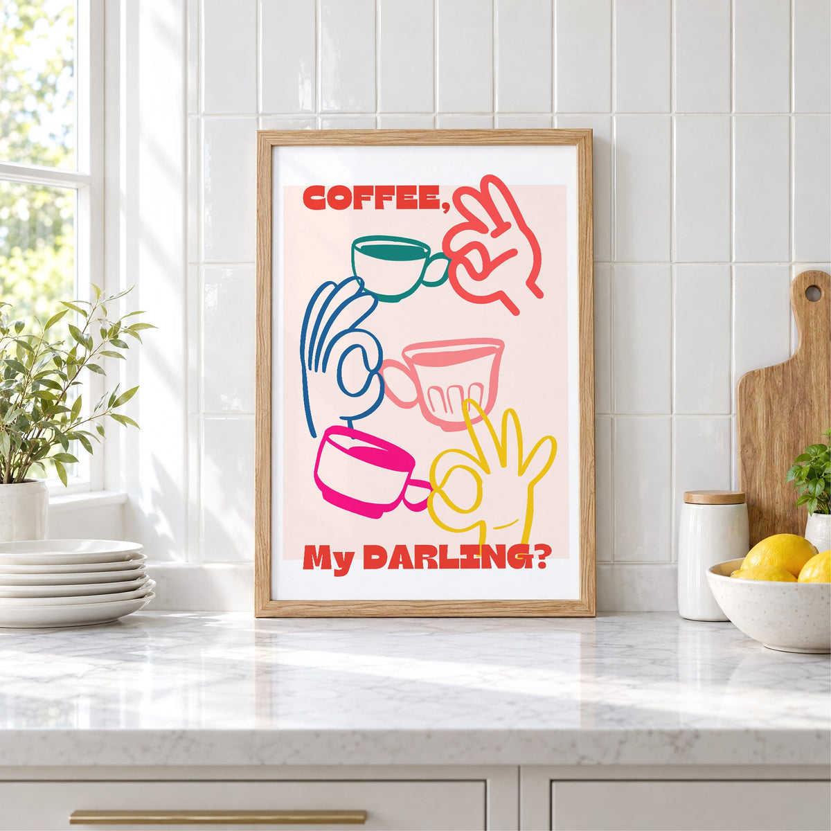 Coffee My Darling colorful hands print in an oak frame leaning on a marble counter by white tiles and lemons