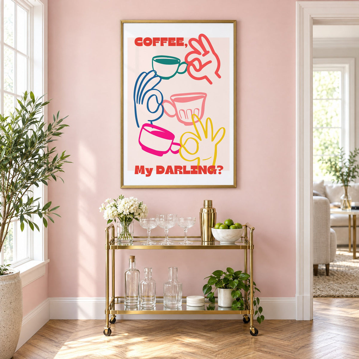 Coffee My Darling colorful hands print in a brass frame above a gold bar cart on a blush pink wall