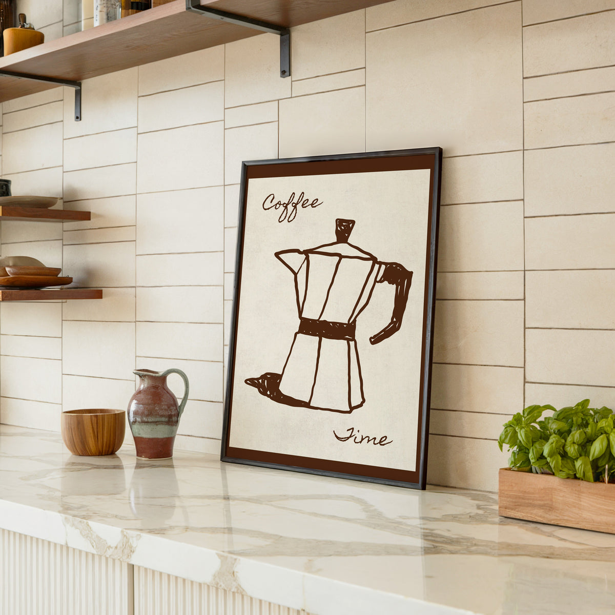 Coffee Time moka pot print in a black frame leaning on a marble counter in a tiled kitchen