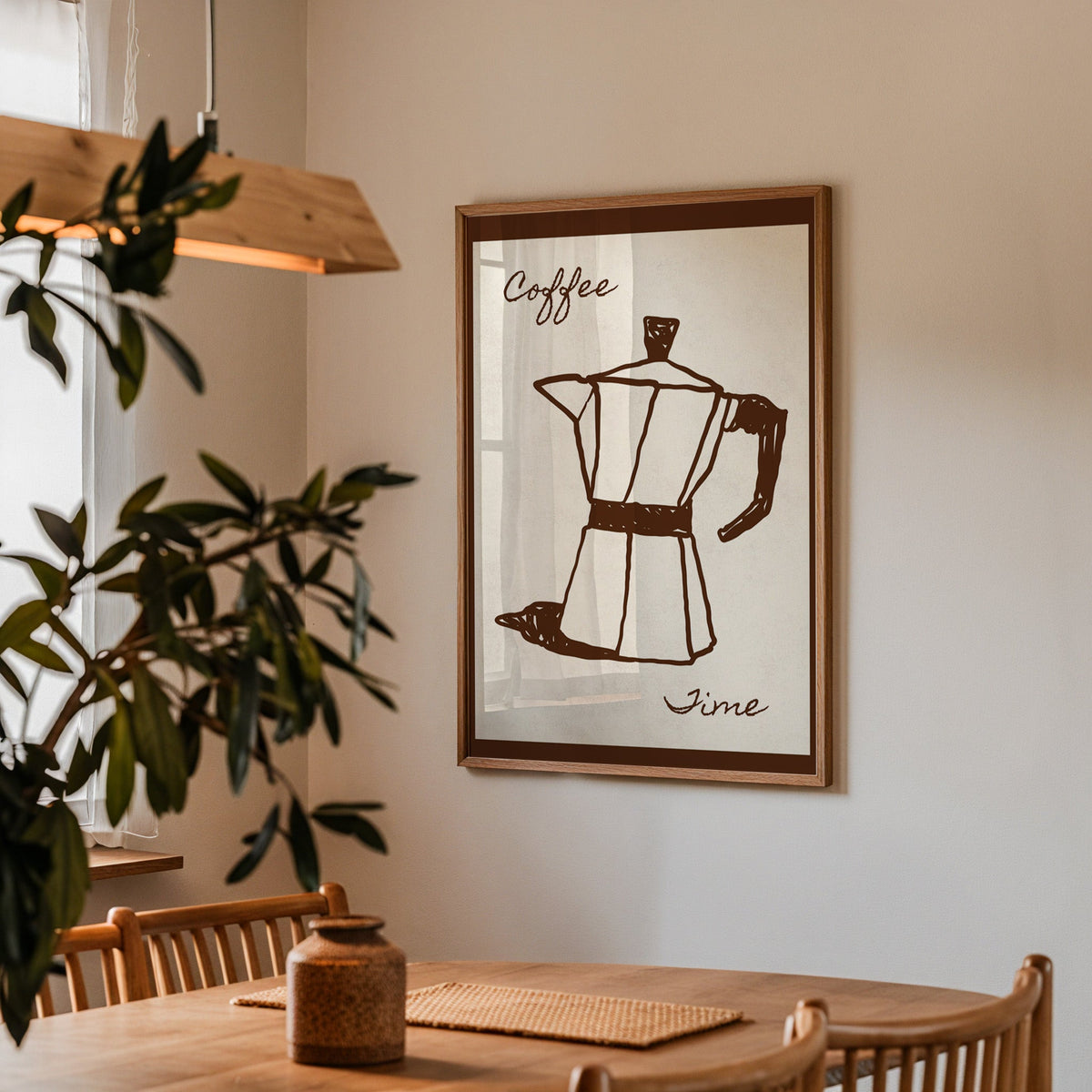 Coffee Time moka pot print in a walnut frame above a dining table with olive branches