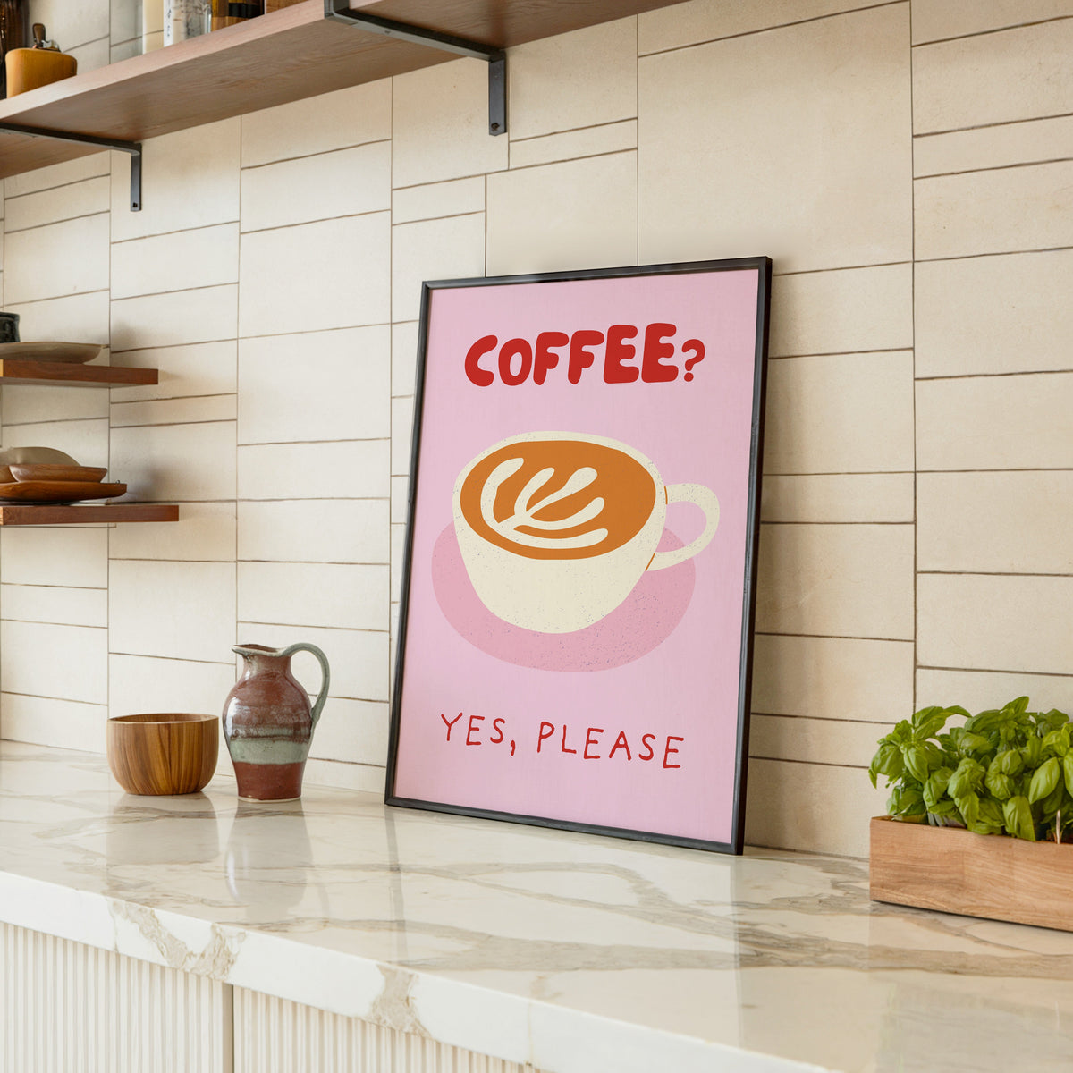 Coffee Yes Please print in a black frame leaning on a marble counter in a tiled kitchen
