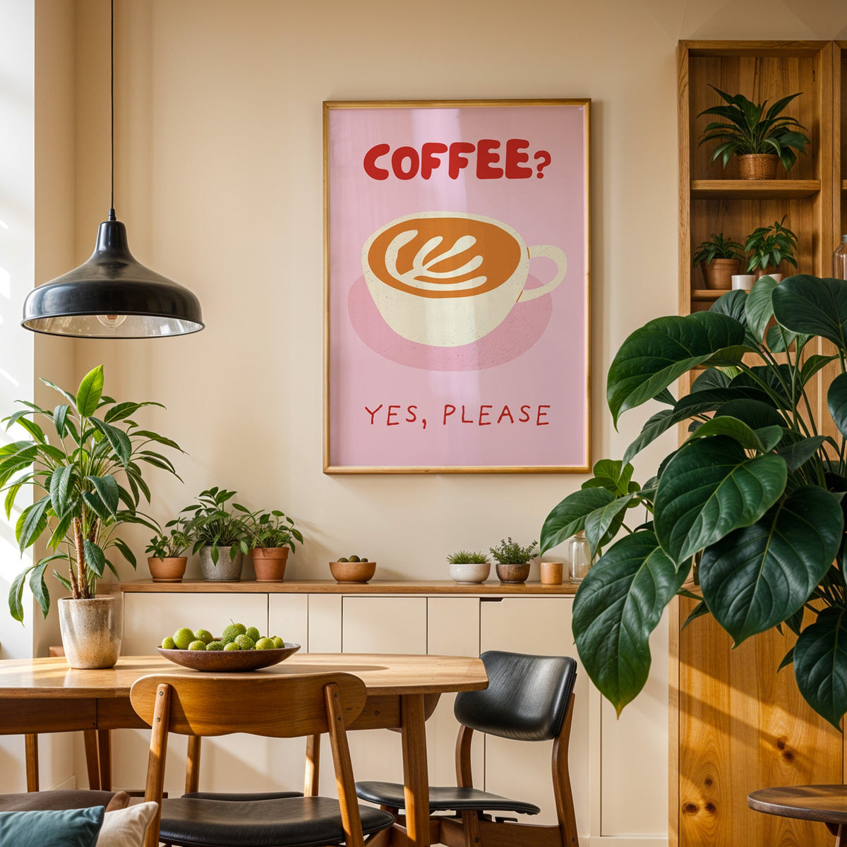 Coffee Yes Please print in an oak frame in a dining room above a plant-lined sideboard
