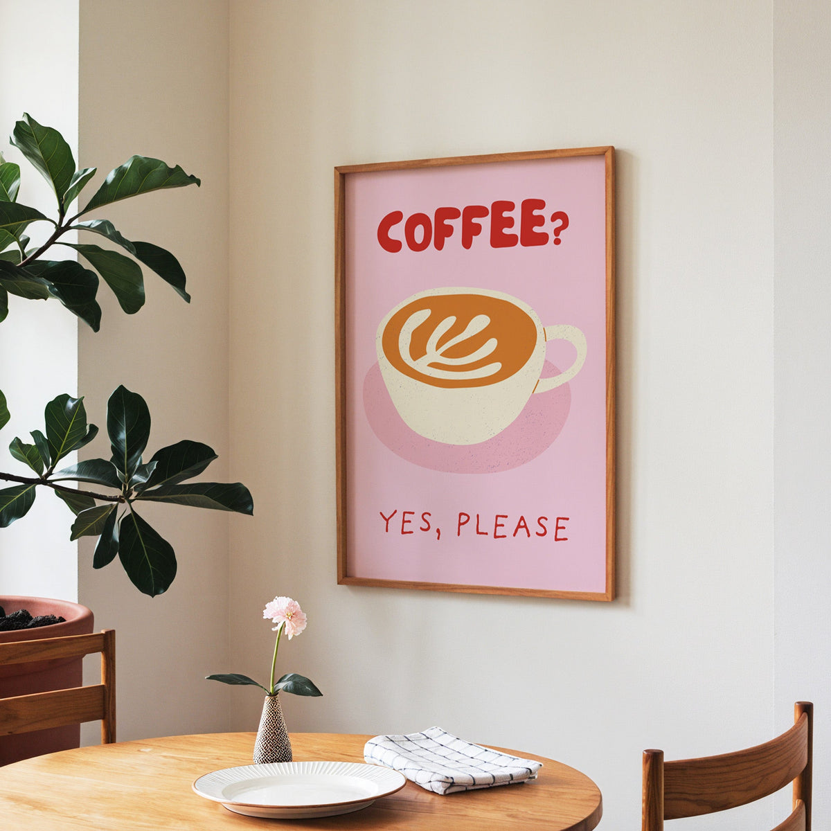 Coffee Yes Please print in a walnut frame above a round table beside a fiddle-leaf fig