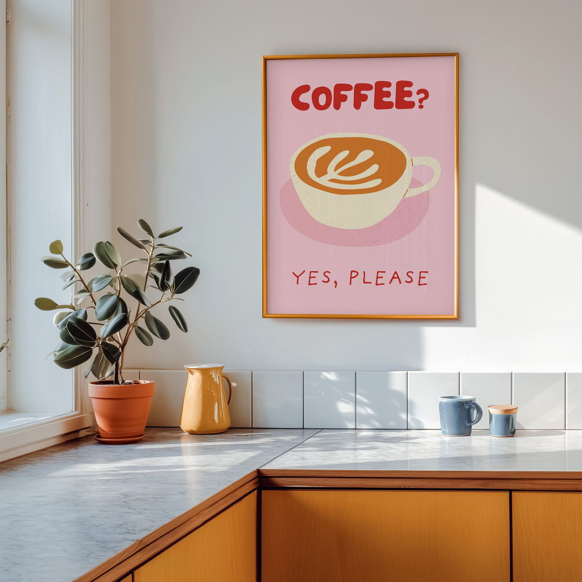 Coffee Yes Please print shown in a gold frame above a marble counter in a tan kitchen