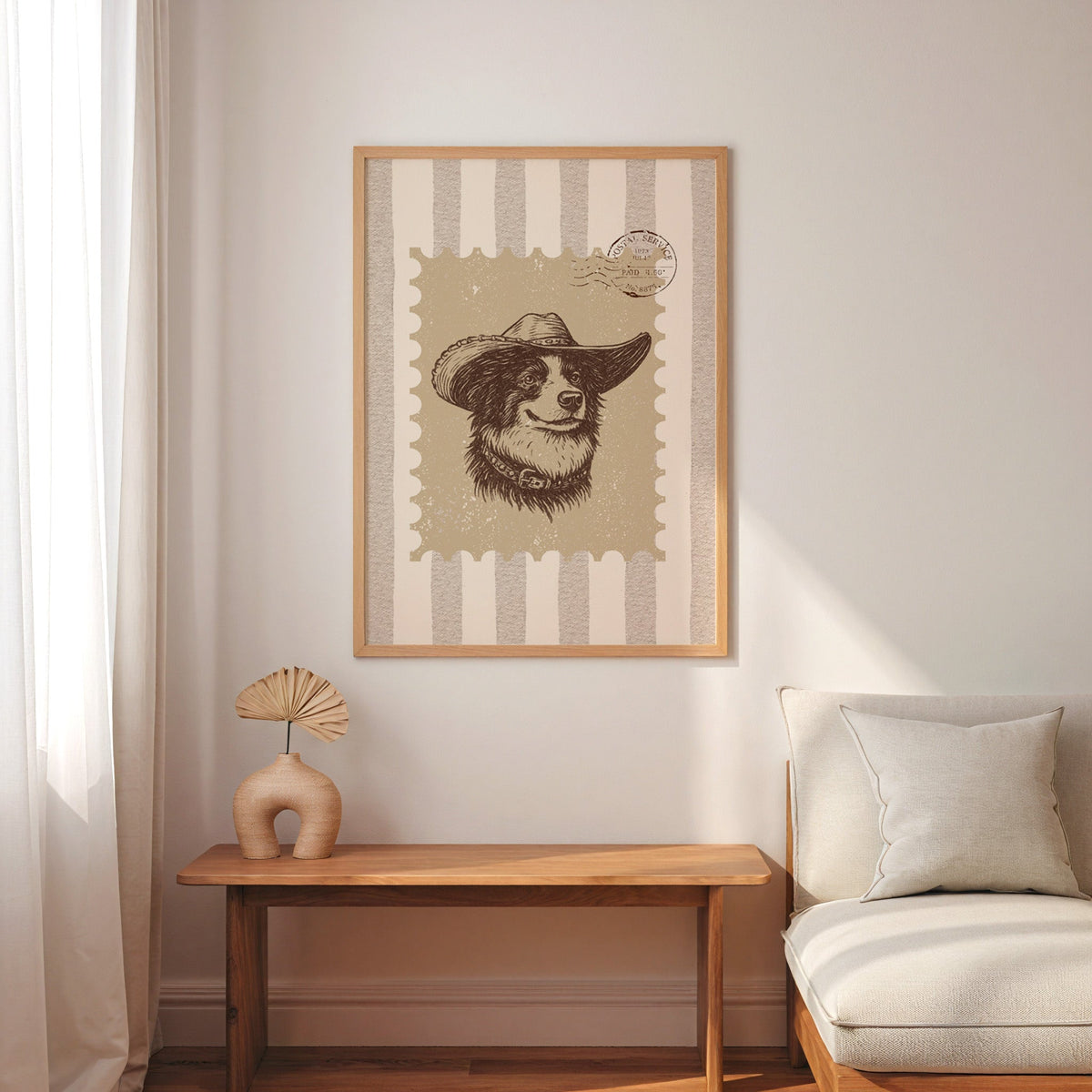Collie cowboy hat stamp print in an oak frame above a console with an arch vase