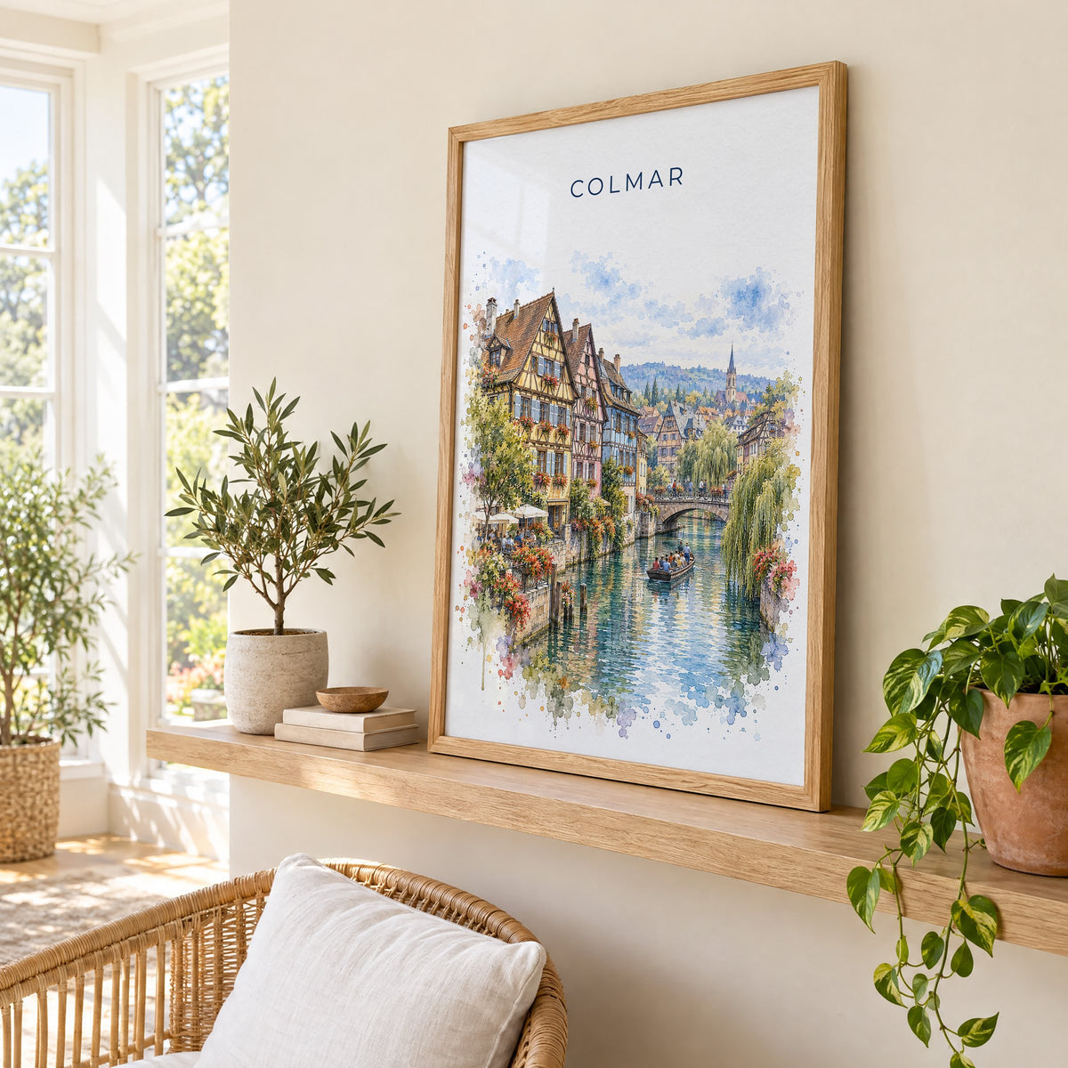Colmar watercolor print in an oak frame on a picture ledge in a sunlit sunroom
