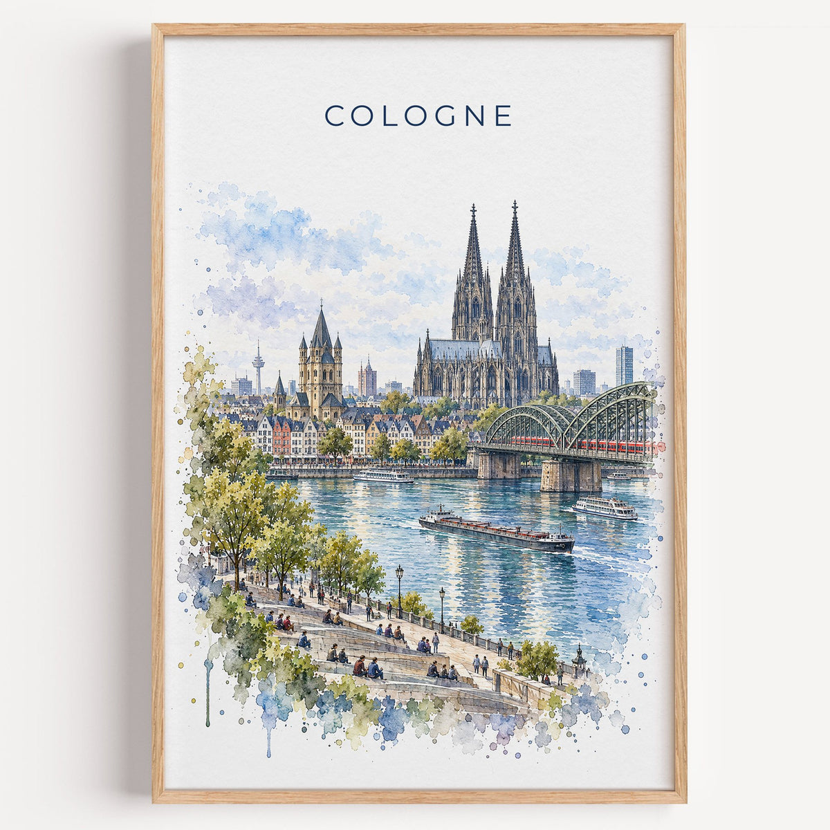 Cologne watercolor print in a light oak frame on a plain white wall
