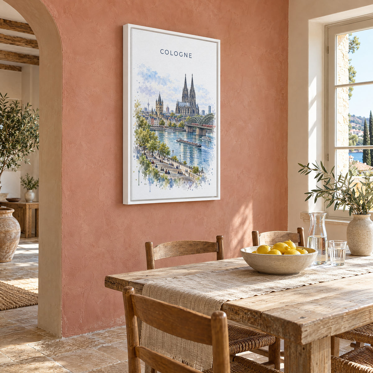 Cologne watercolor print as a white floater canvas on a terracotta wall above a rustic dining table