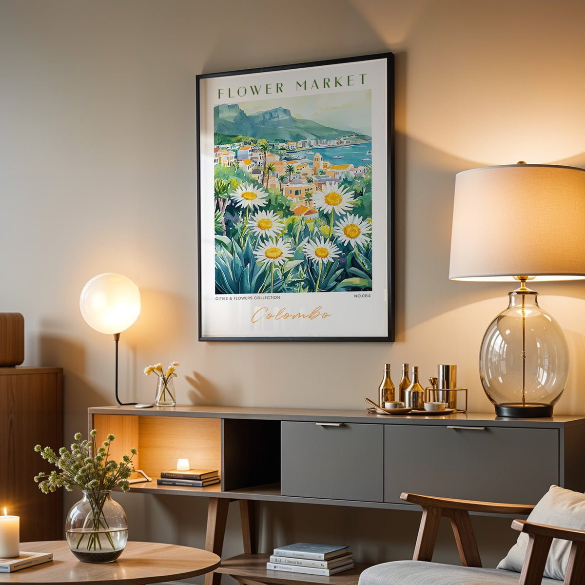 Colombo flower market print in a black frame above a grey media console with a glass table lamp