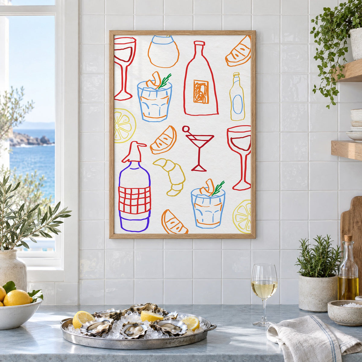 Colorful bar drinks doodle pattern print in an oak frame on white tiles above a marble counter with oysters and lemons by a sea view