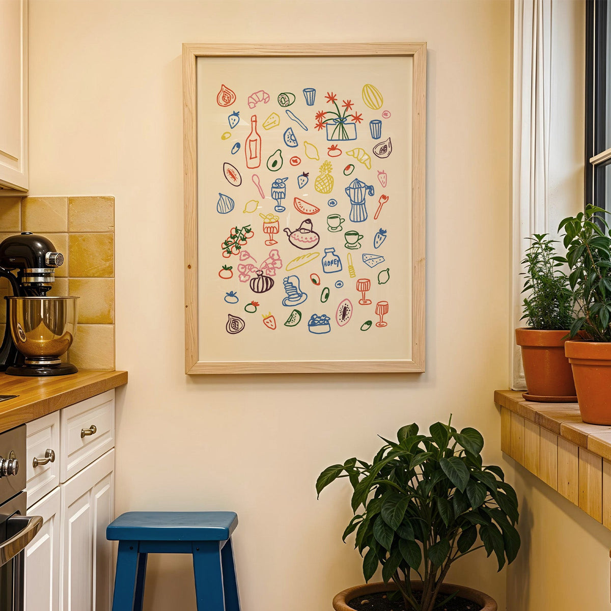 Colorful food doodle print in a wood frame on a yellow tiled kitchen wall