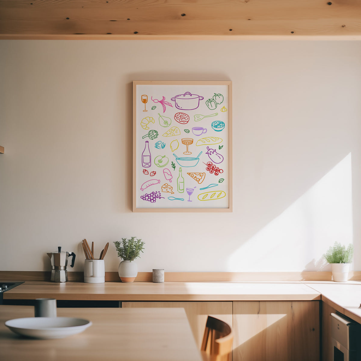 Food doodle print in an oak frame above a wood counter with a moka pot and herbs