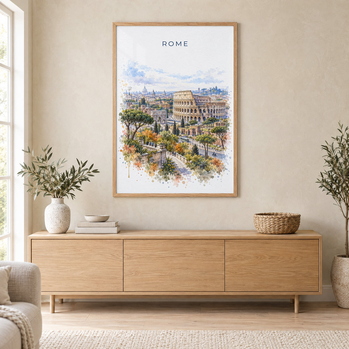 Colosseum watercolor print in an oak frame above a light wood sideboard in a Scandinavian living room