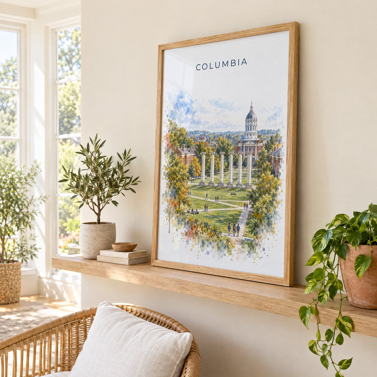 Columbia, Missouri watercolor print in an oak frame on a picture ledge in a sunlit sunroom