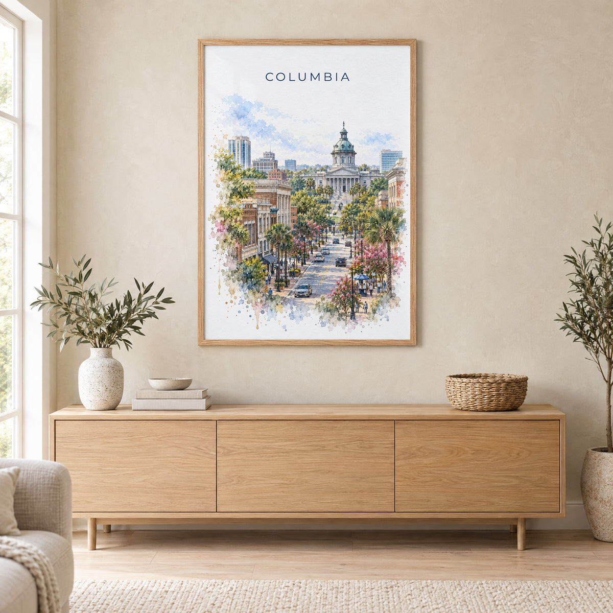 Columbia, South Carolina watercolor print in an oak frame above a light wood sideboard in a Scandinavian living room