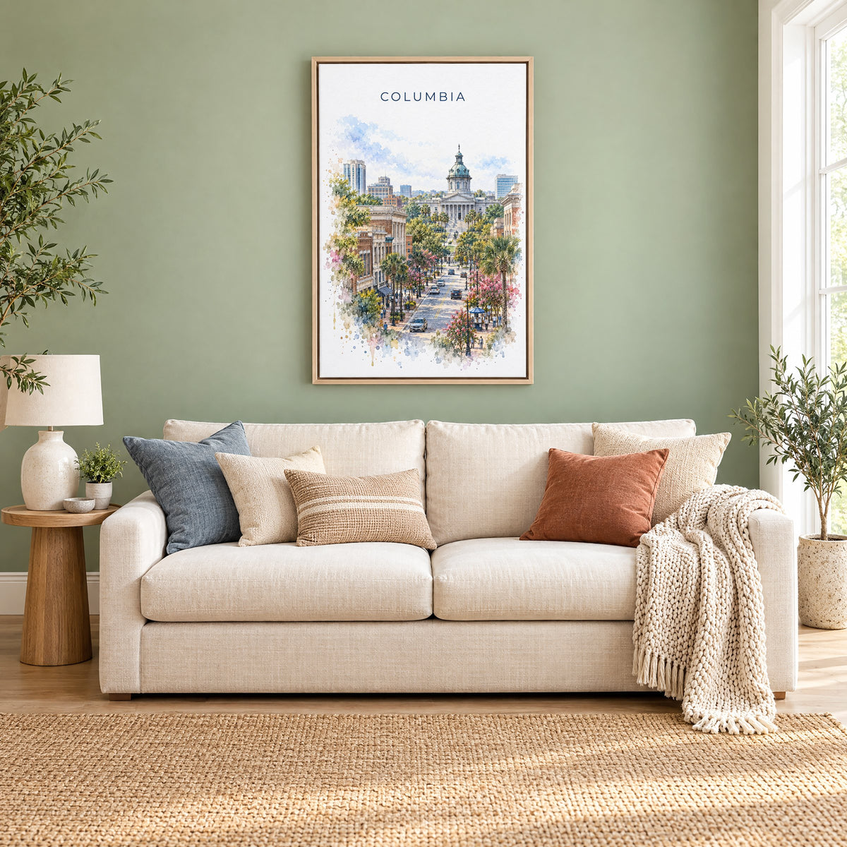 Columbia, South Carolina watercolor print as a natural floater canvas above a cream linen sofa on a sage green wall
