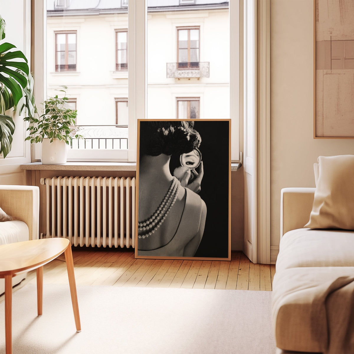 Woman from behind, eye in compact mirror, pearls print in an oak frame leaning by a French window in a living room