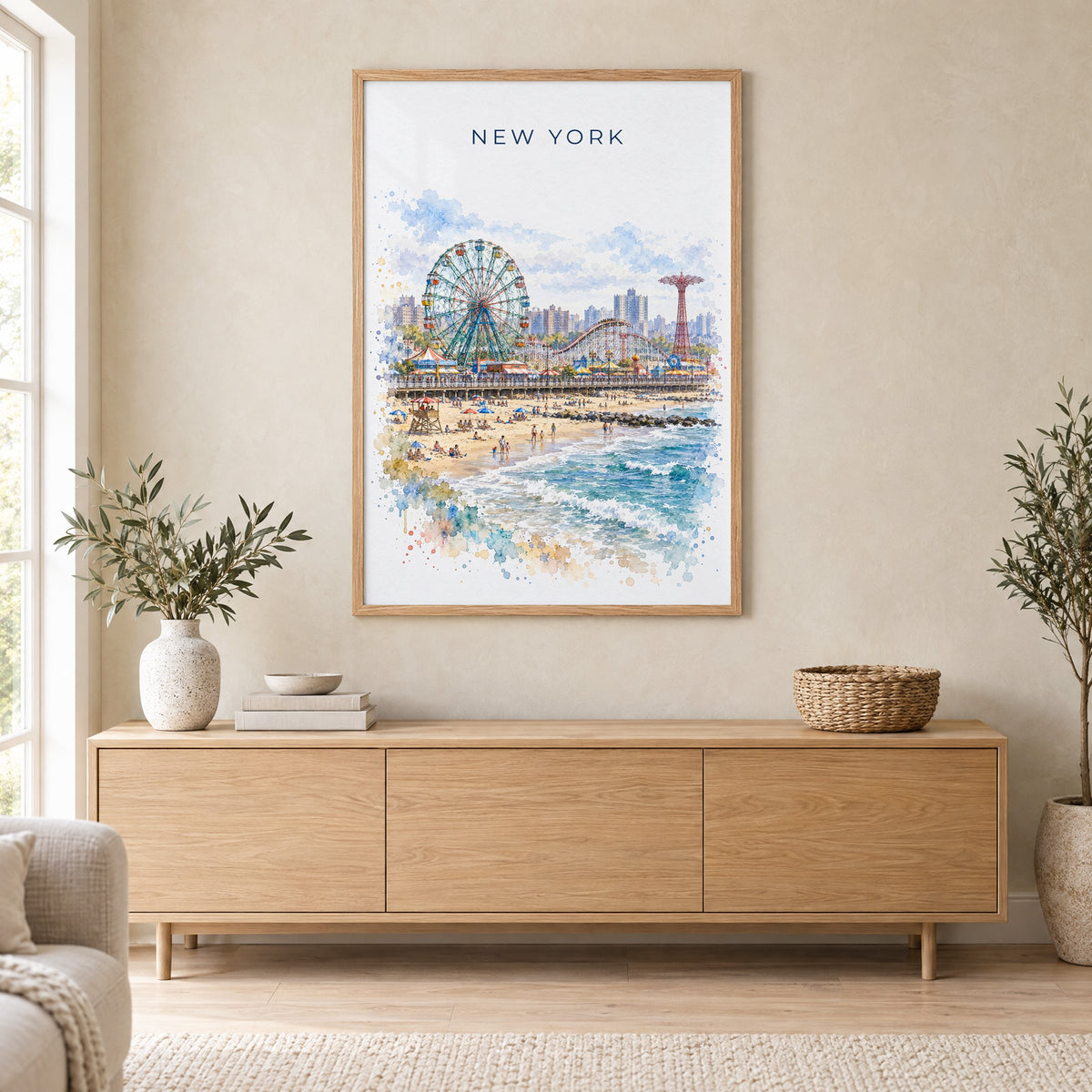 Coney Island watercolor print in an oak frame above a light wood sideboard in a Scandinavian living room