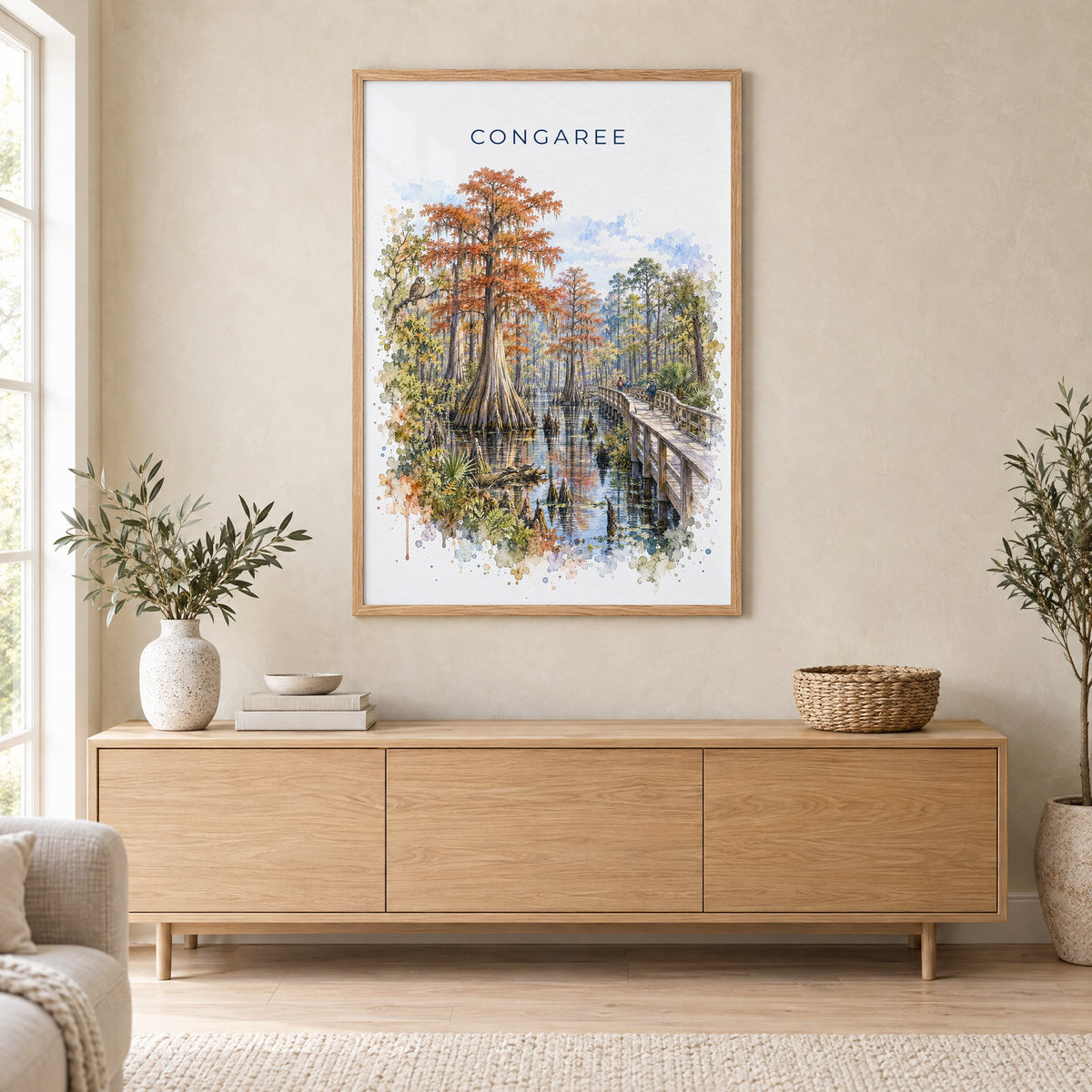 Congaree National Park watercolor print in an oak frame above a light wood sideboard in a Scandinavian living room