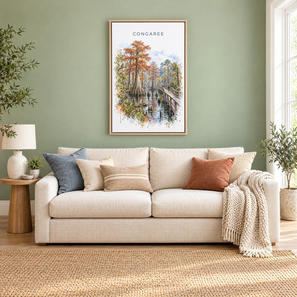 Congaree National Park watercolor print as a natural floater canvas above a cream linen sofa on a sage green wall