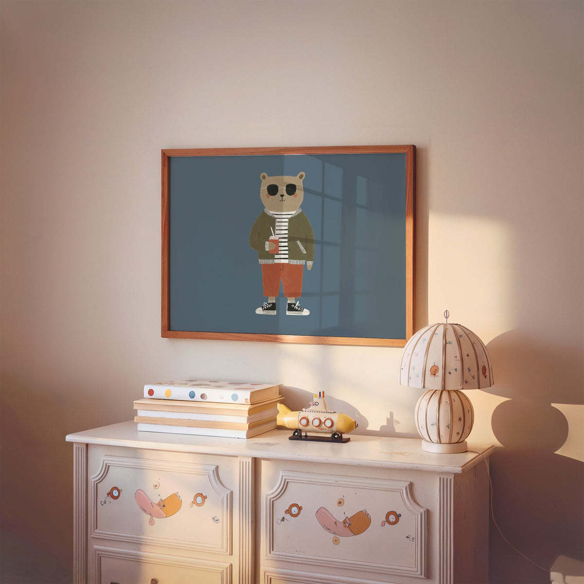 Landscape cool bear sunglasses juice box nursery print in a cherry wood frame above a painted dresser and lamp