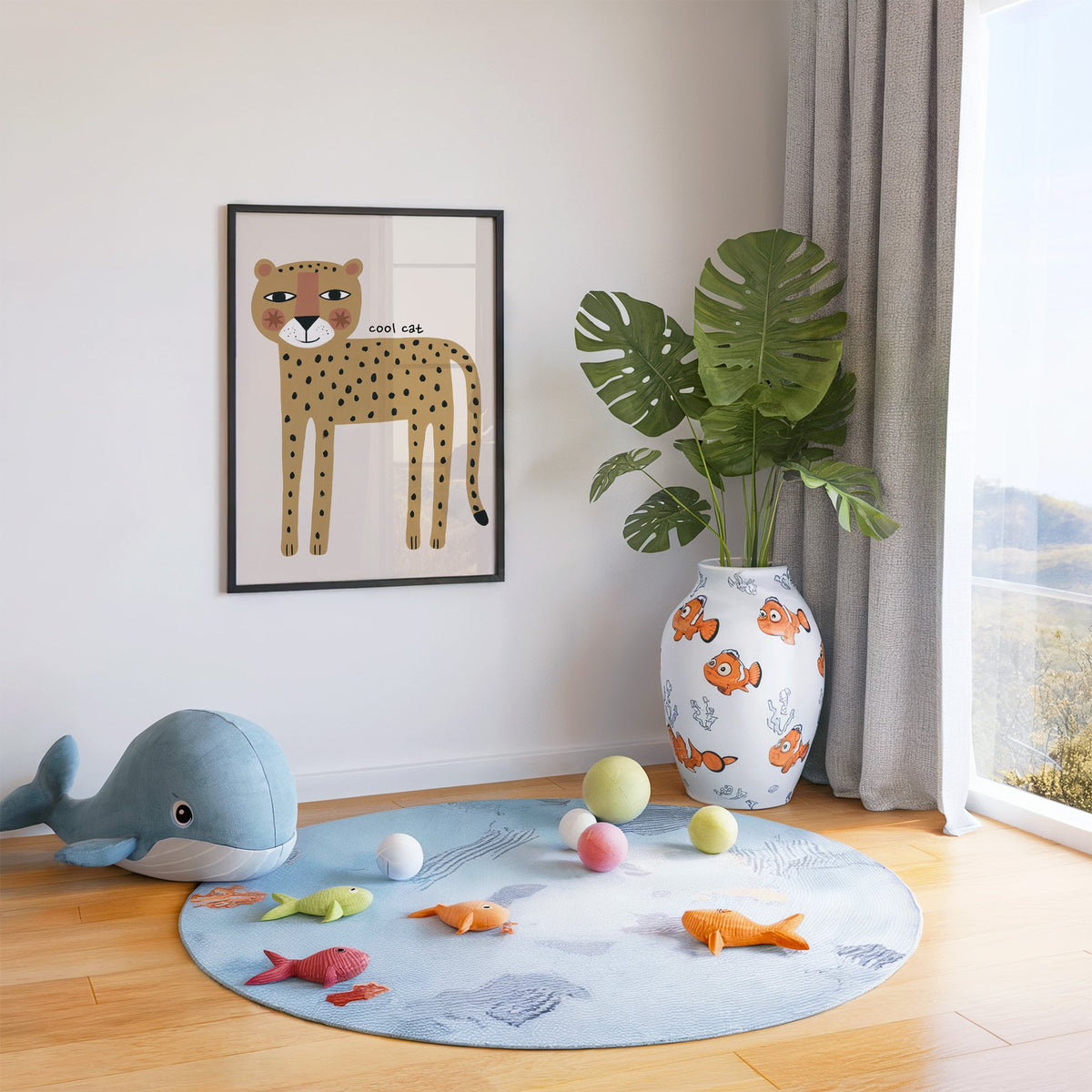 Cool cat cheetah nursery print in a black frame in a playroom with an ocean rug and whale plush