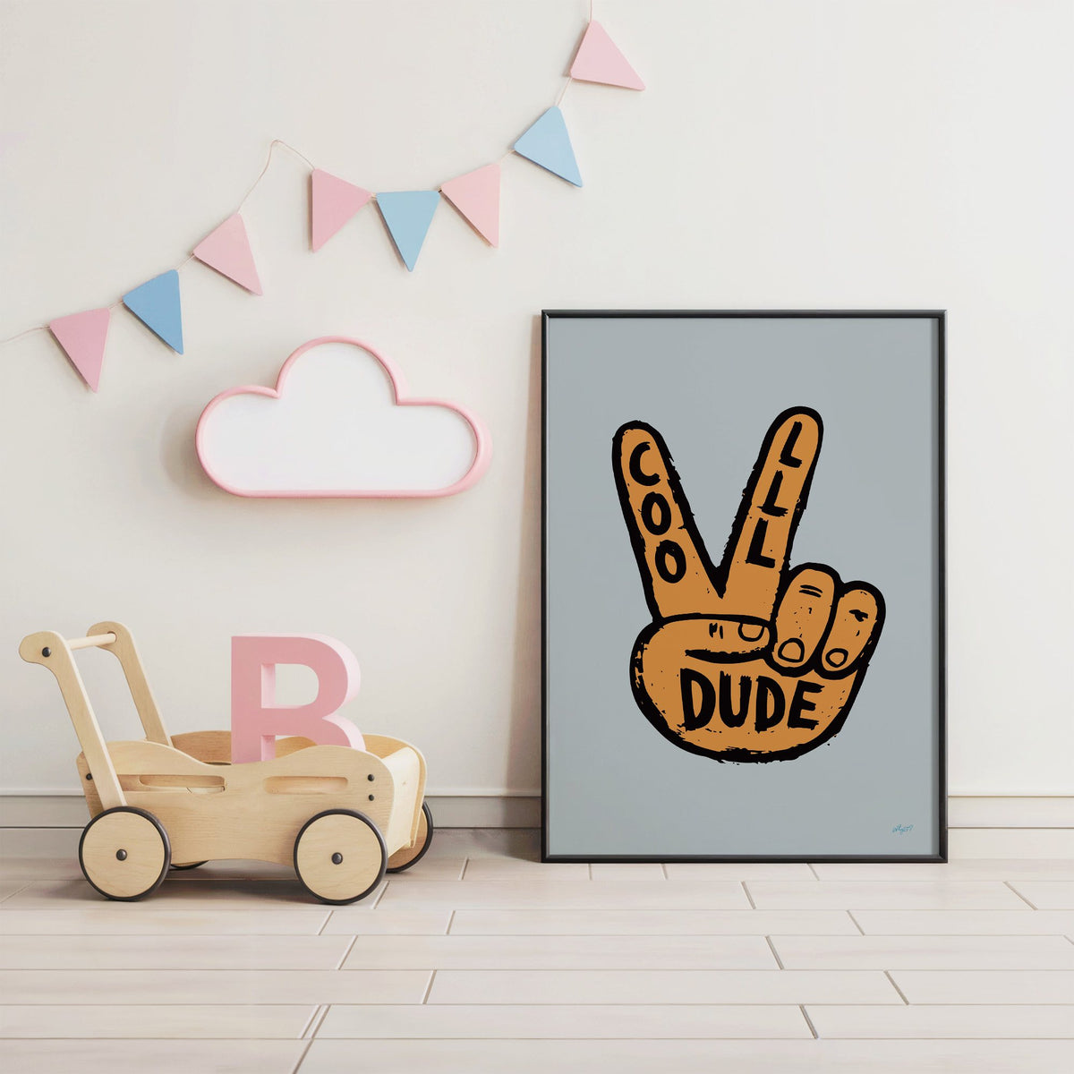 Cool dude peace sign hand nursery print in a black frame under pastel bunting by a wooden baby walker