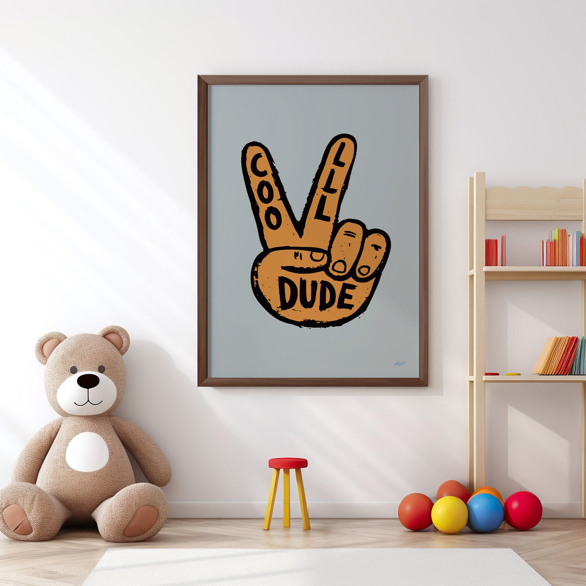 Cool dude peace sign hand nursery print in a walnut frame above a big teddy bear by a bookshelf