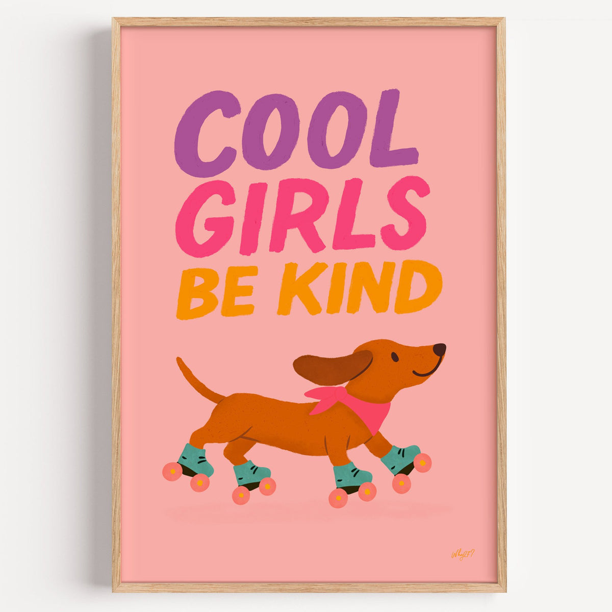Cool girls be kind dachshund nursery print in a light oak frame on a plain white wall