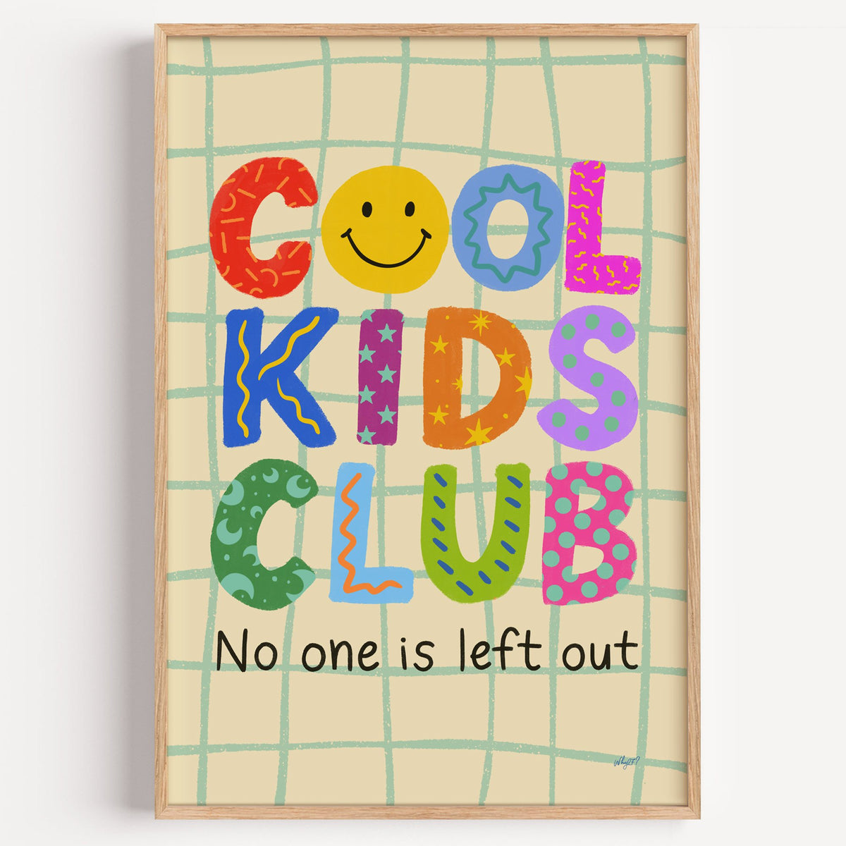 Cool kids club colourful letters nursery print in a light oak frame on a plain white wall