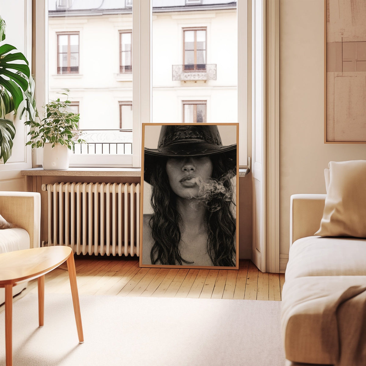 Cowboy hat brim and smoke from lips closeup print in an oak frame leaning by a French window in a living room