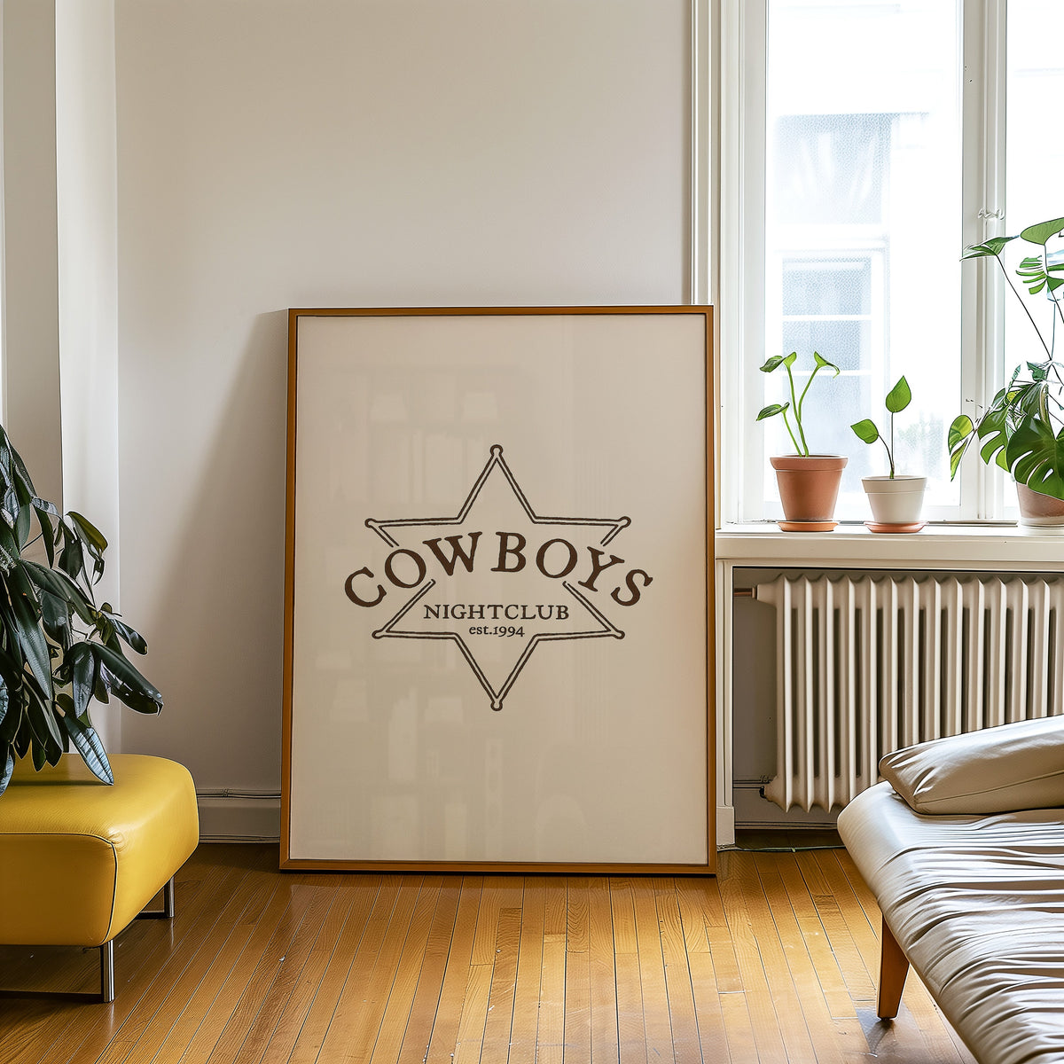 Cowboys Nightclub star print in an oak frame on a parquet floor beside a yellow bench