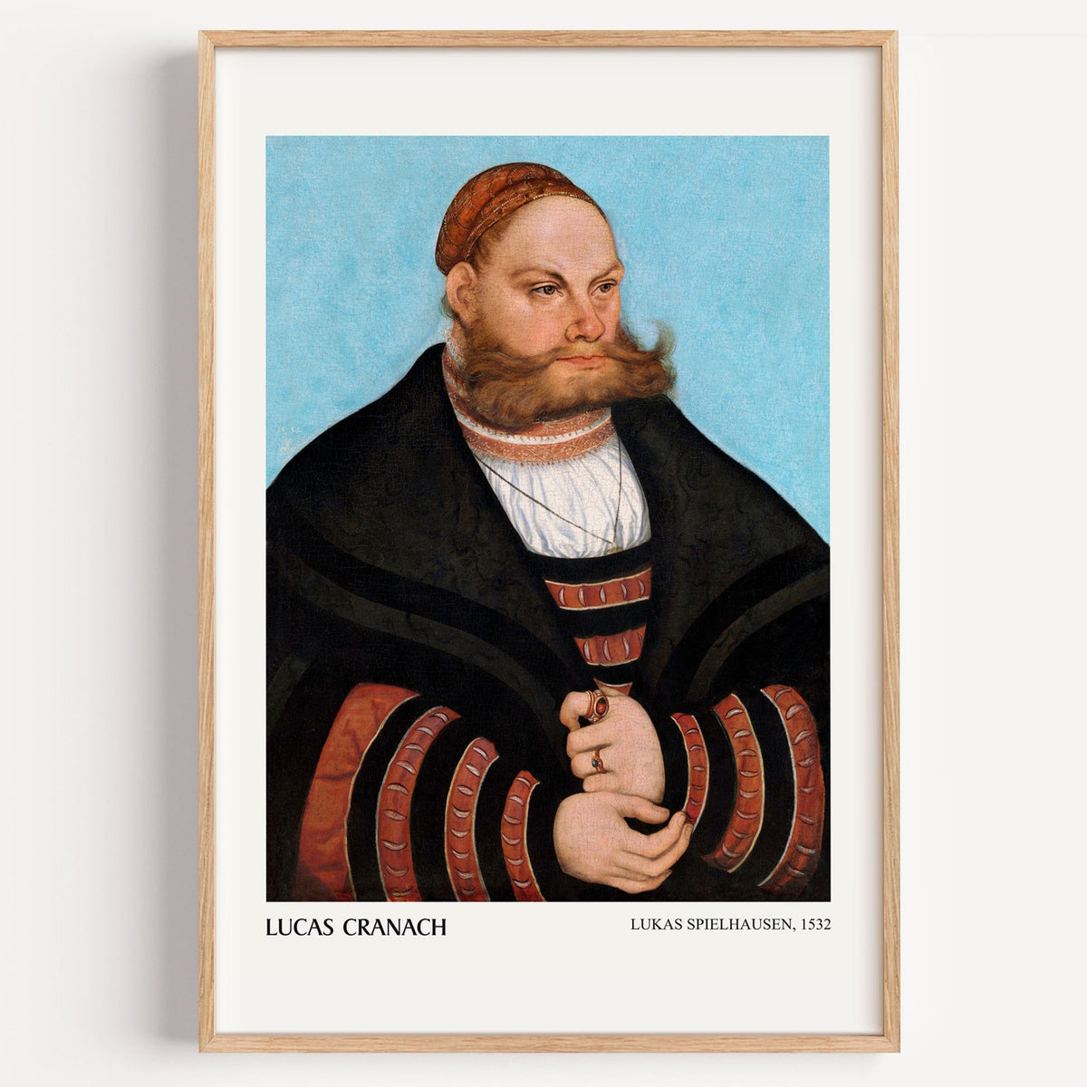 Lucas Cranach Lukas Spielhausen portrait print in a light oak frame on a white wall
